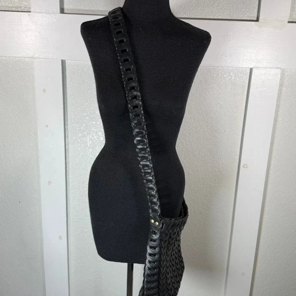Black woven leather shoulder bag with strap